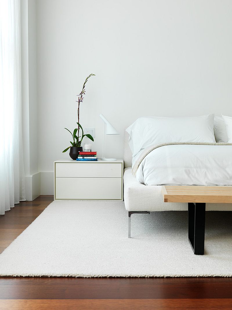 Minimal modern bedroom in white with wooden floor