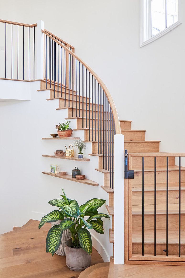 Modern floating shelves under the staircase feels simple and elegant