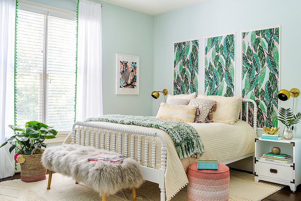 Pastel colors coupled with greenery in the spacious, light-filled tropical bedroom