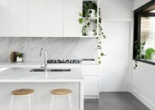 Sleek-cabinets-and-closed-storage-units-give-this-kitchen-a-minimal-appeal-217x155