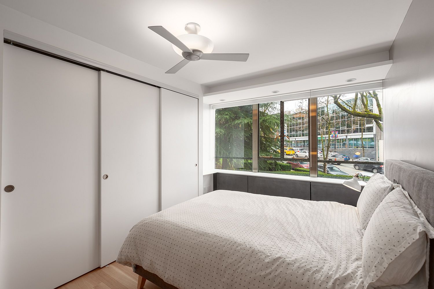 Sliding closet doors in white give the bedroom a space-savvy appeal