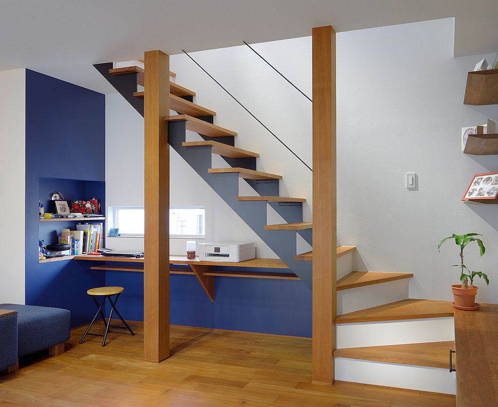 Slim and contemporary workspace underneath the staircase