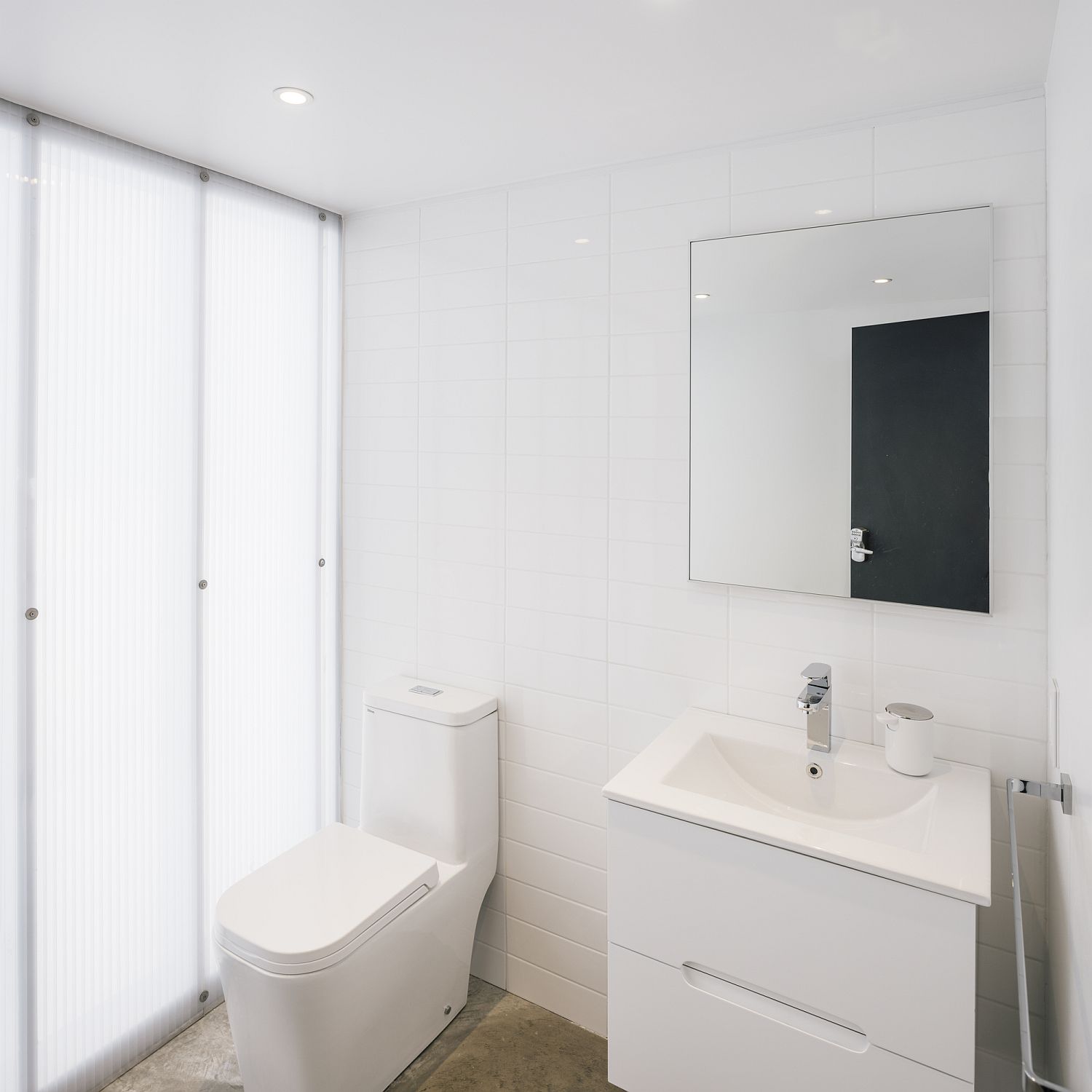 Small-bathroom-in-white-with-ample-natural-lighting