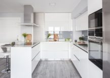 Smart-and-stylish-kitchen-in-white-saves-ample-space-with-its-smart-design-217x155