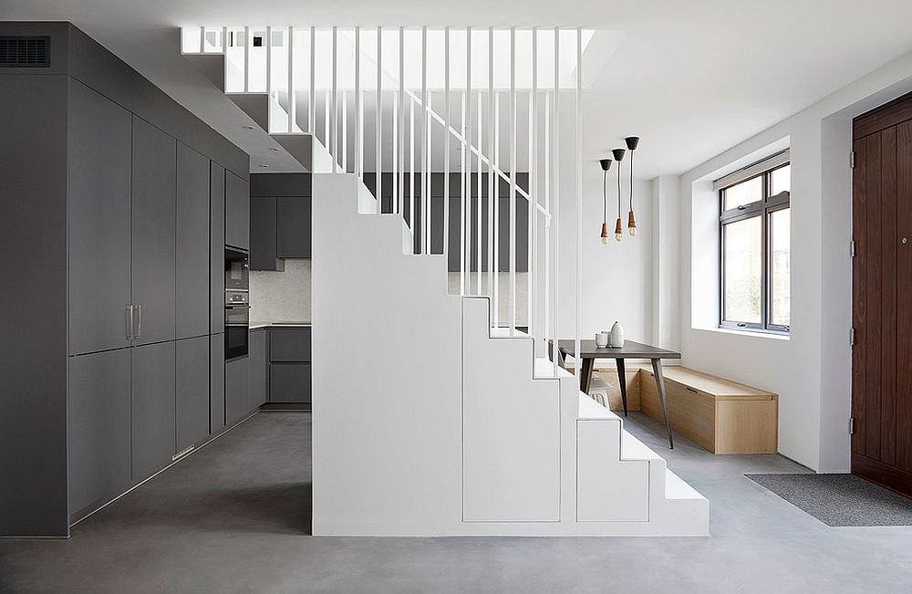 Smart stairway easily doubles as a storage space in the contemporary setting