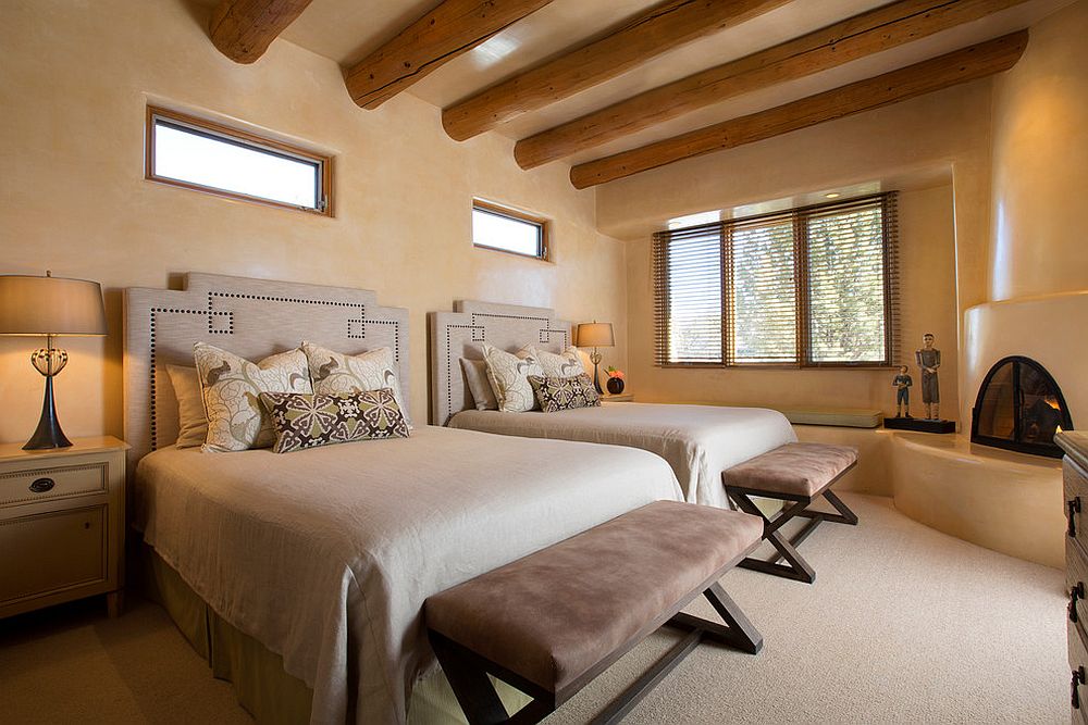 Smart-textured-walls-and-corner-fireplace-for-the-bedroom-with-ceiling-beams