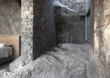 Stone-walls-coupled-with-large-natural-rock-give-the-interior-a-unique-appeal-217x155