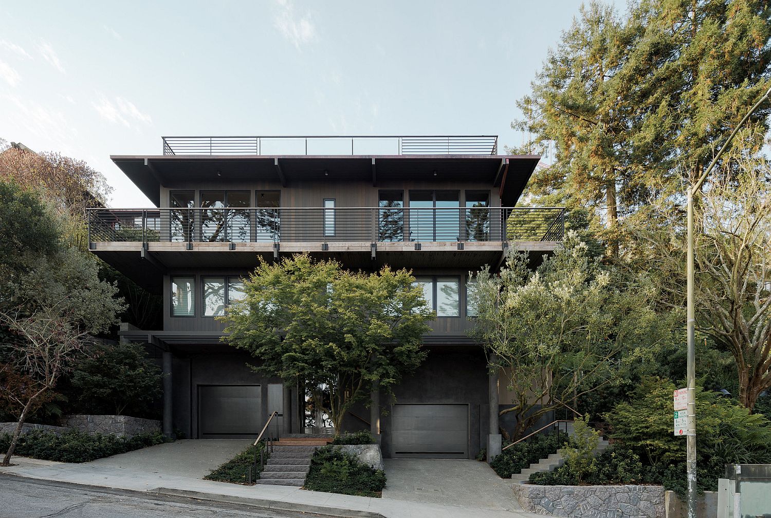 Street facade of the multi-level contemporary house with a view of the Golden Gate bridge