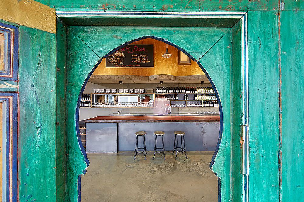 Striking green doors with Moroccan flavor welcome you to this winery in Ferguson Valley, Western Australia