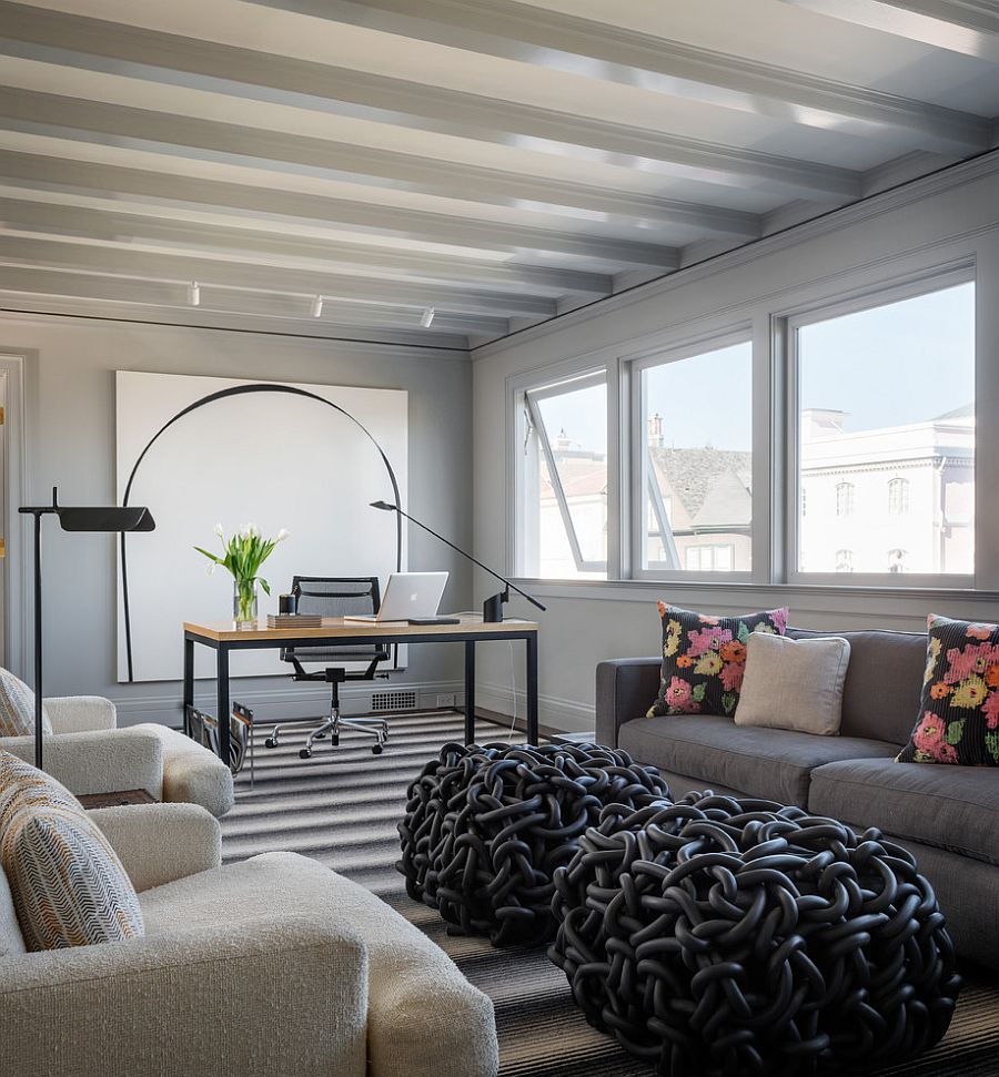 Transitional home office in white with ceiling beams that add a different dimension to the room