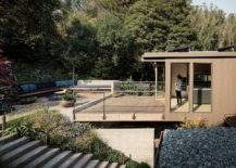 Upper-level-deck-with-garden-all-around-and-stairway-leading-to-the-outdoors-217x155