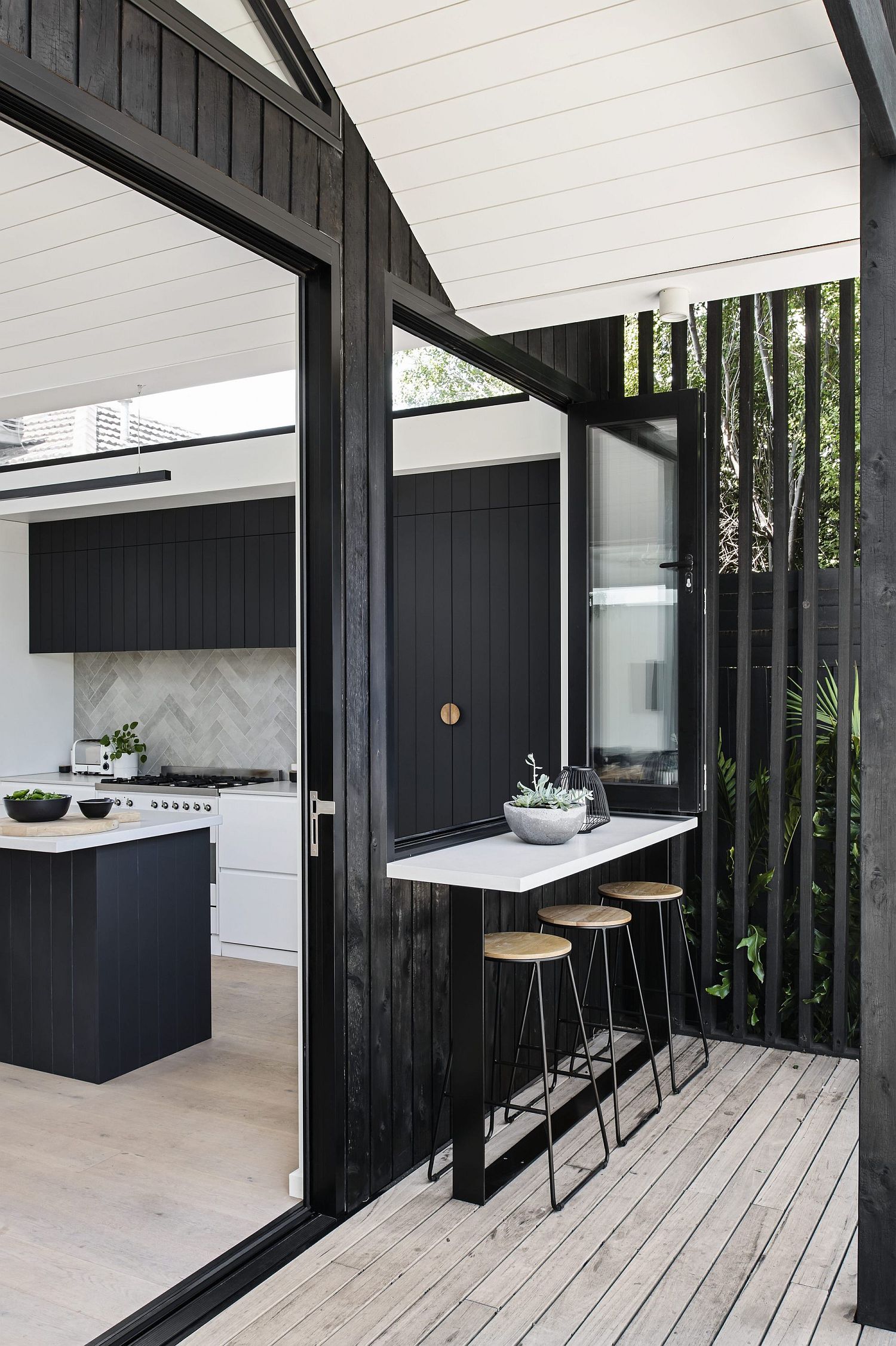 White and dark wooden elements are intertwined beautifully inside the house