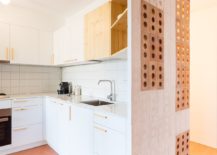White-and-wood-kitchen-of-the-apartment-with-hexagonal-floor-tiles-217x155