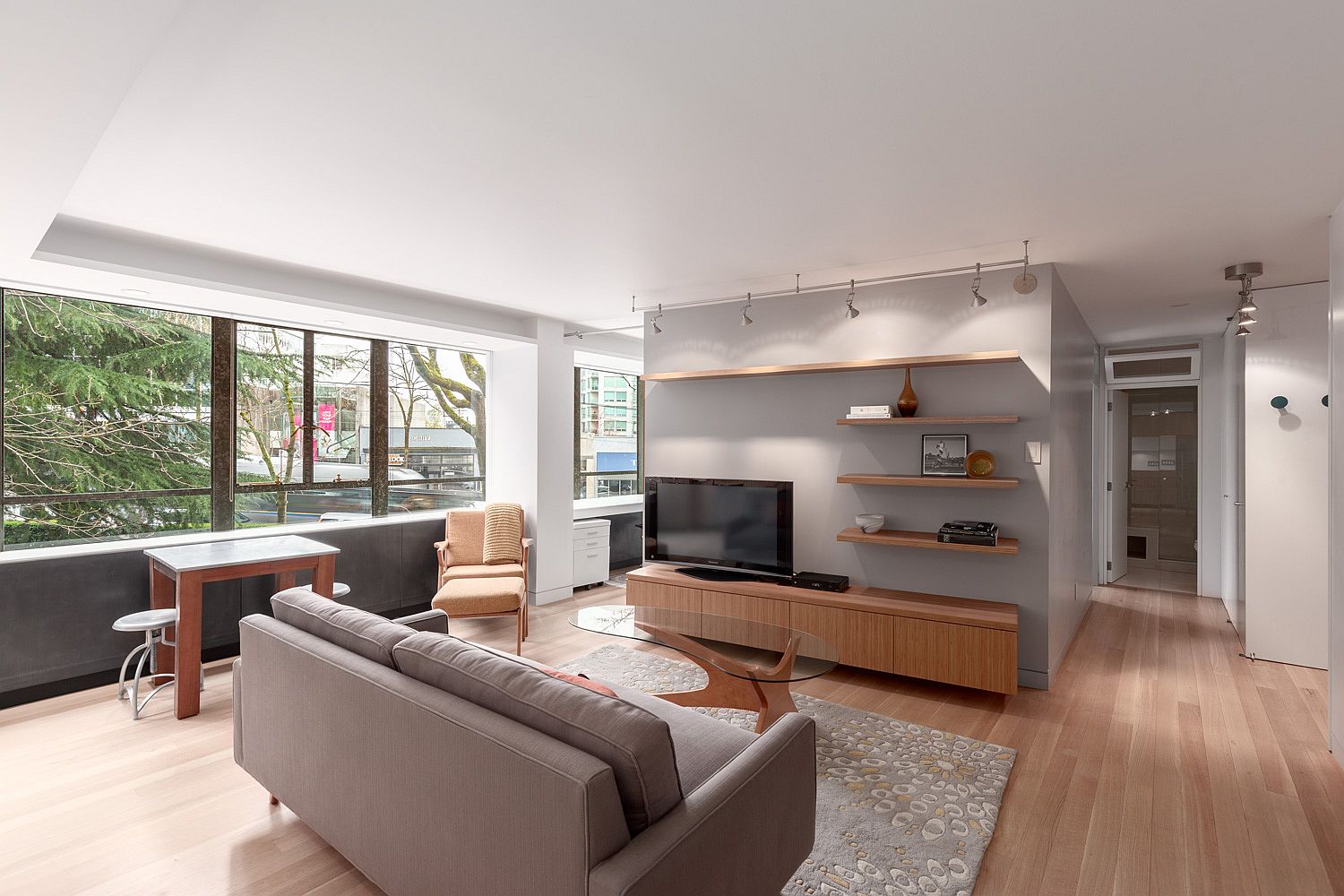 Wood and gray are combined beautifully inside this Vancouver apartment