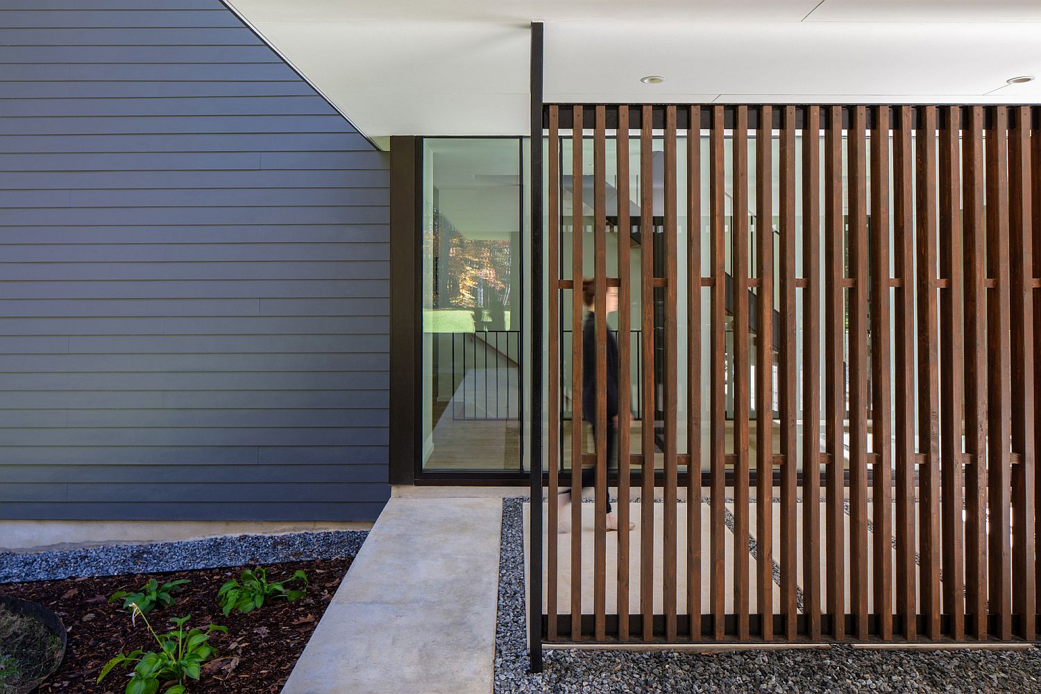 Wooden slats and glass combine privacy with the right natural lighting