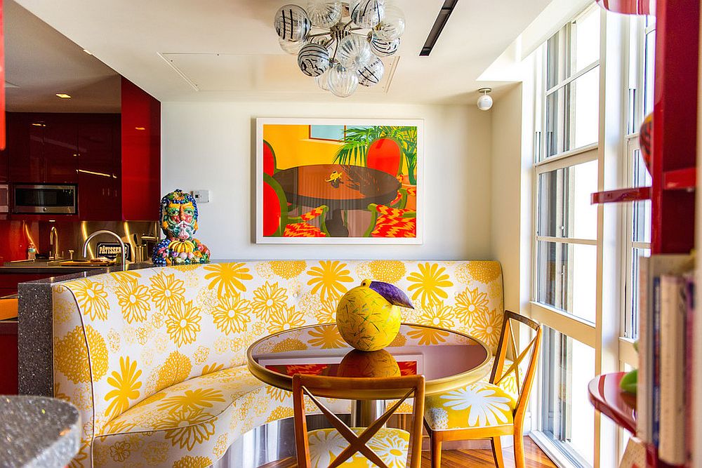 Yellow banquet style seating steals the show in this tropical style dining room