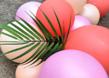 Add-palm-leaves-to-your-balloon-arch-217x155