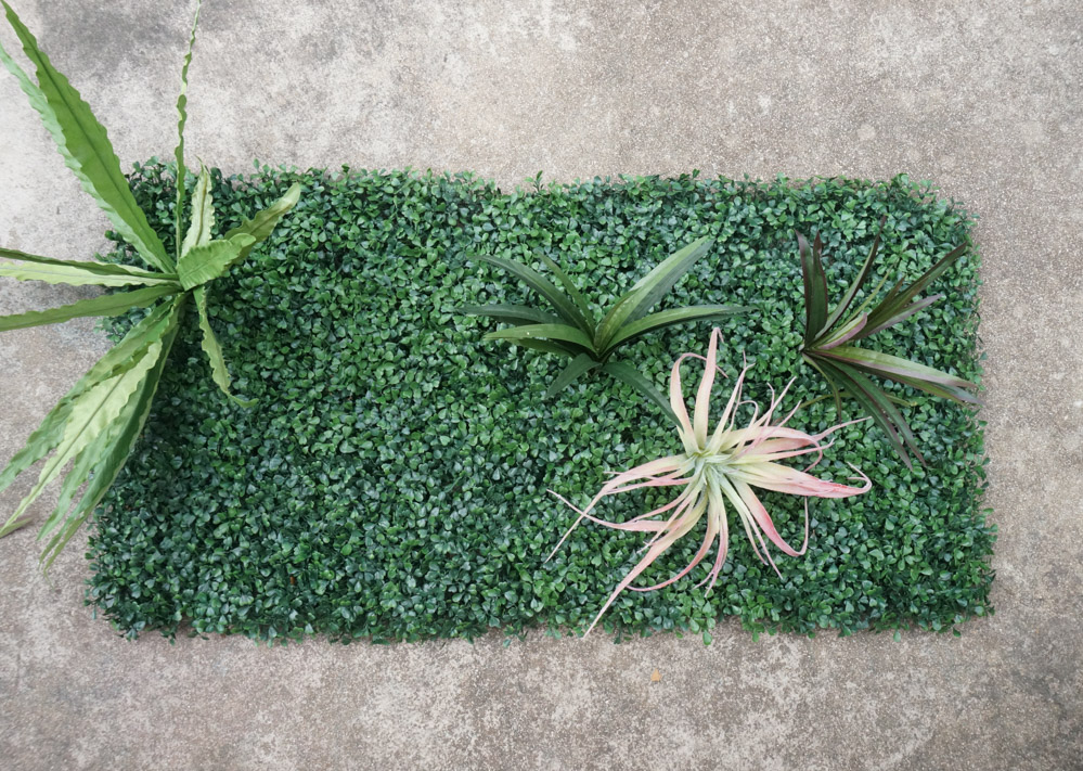 Begin to arrange your greenery on the backdrop