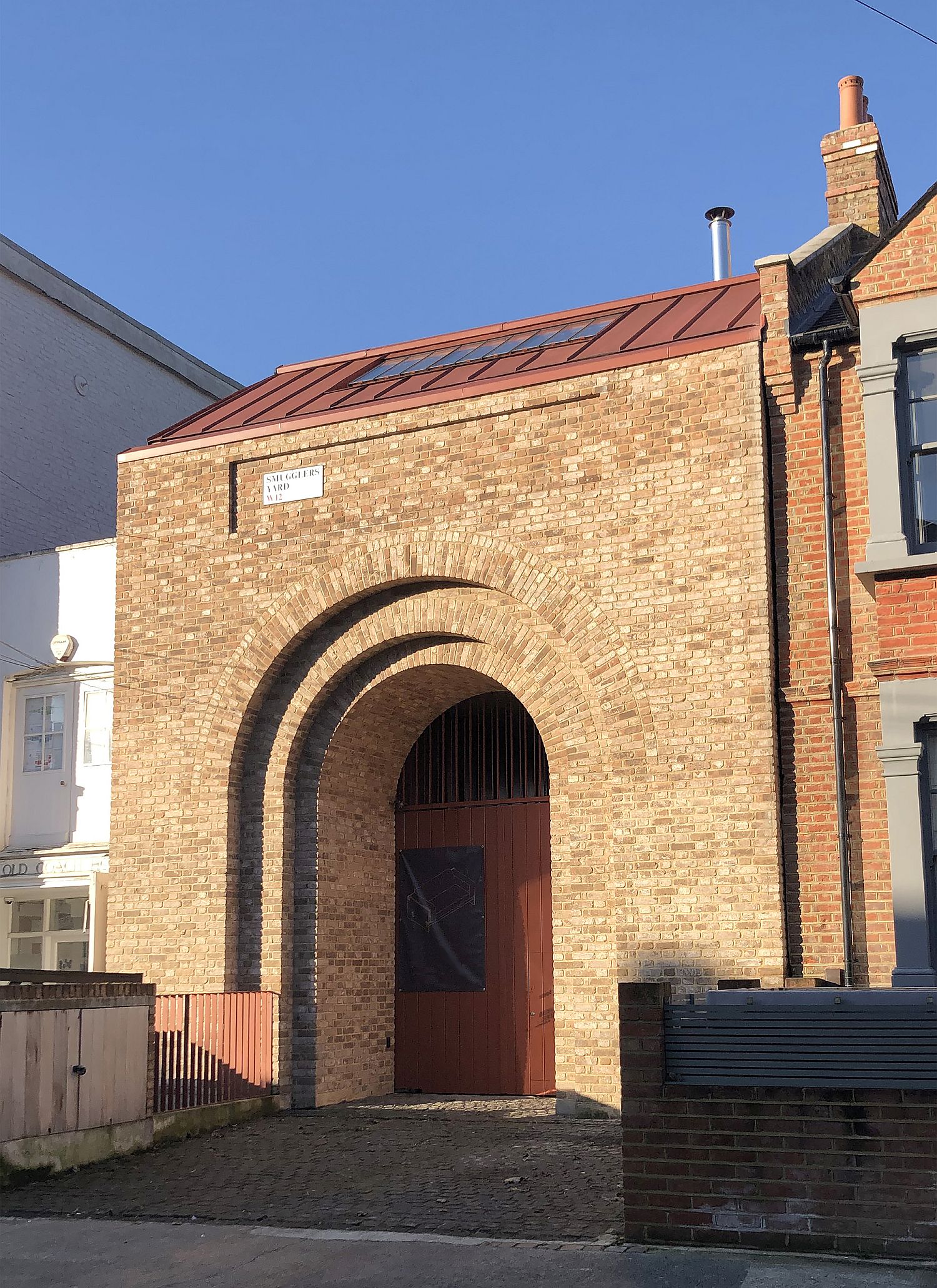 Brick archway welcomes you at this gorgeous British home