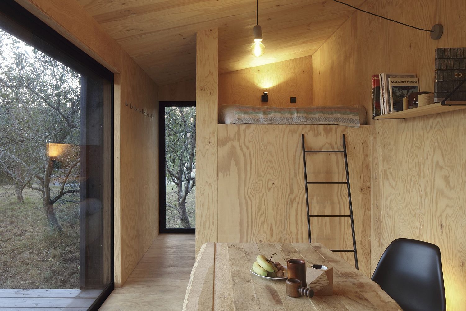 Contrast with light and dark wood elements shapes the lovely cabin
