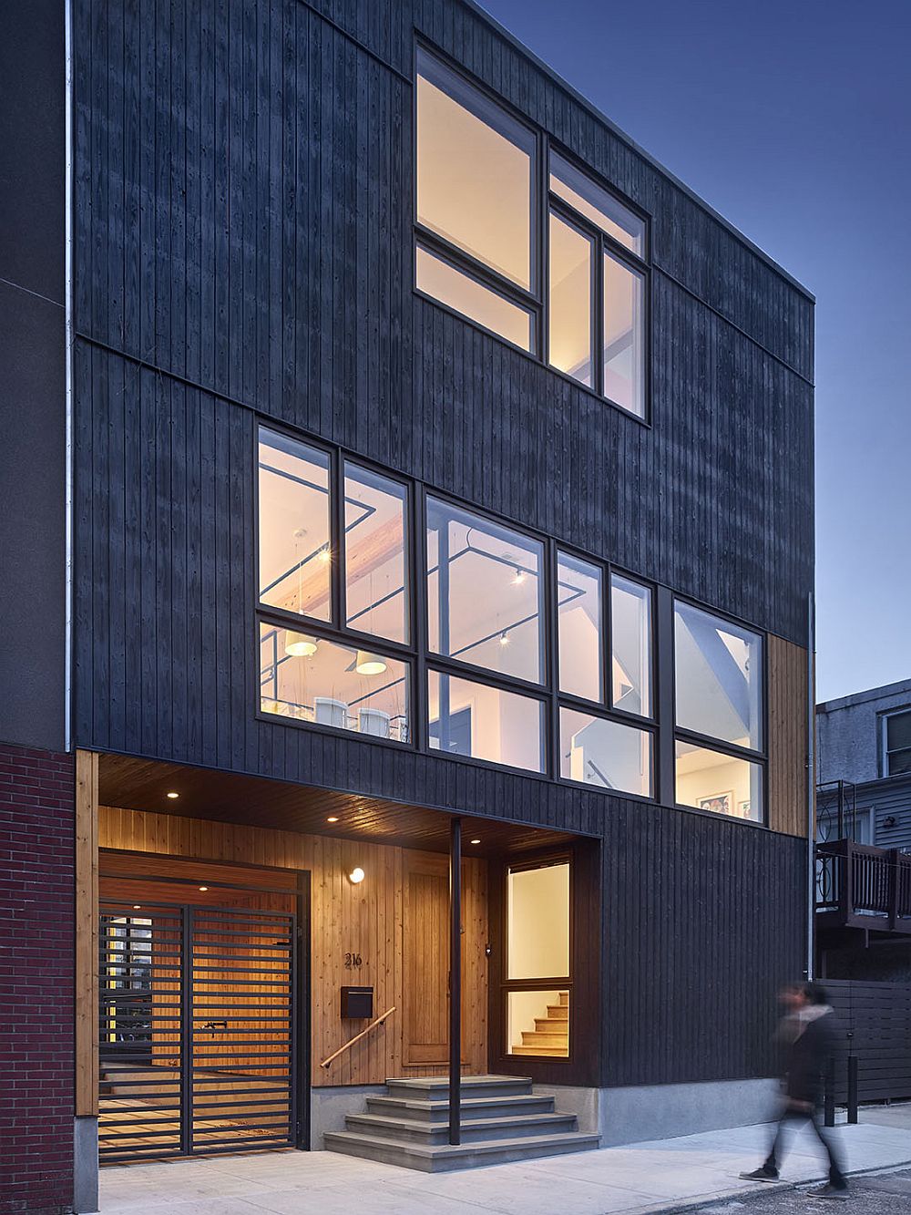 Cypress wood siding shapes the exterior of the house