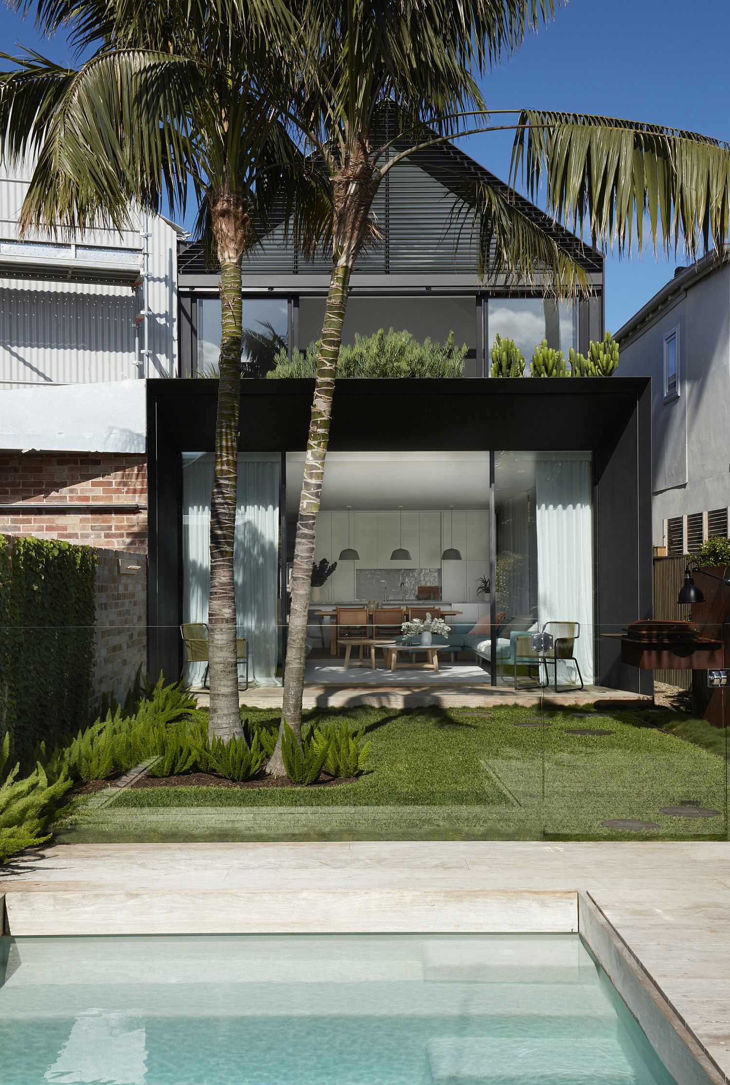 Dark-steel-canopy-with-planted-roof-in-the-rear-makes-a-visual-impact