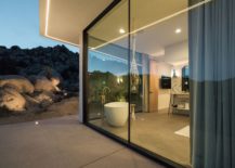 Floor-to-ceiling-glass-walls-open-up-the-interior-to-the-view-outside-217x155