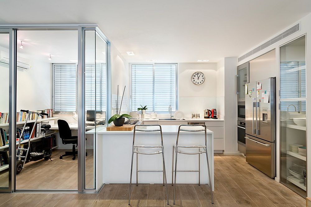 Gorgeous kitchen of Tel Aviv apartment with glass box home office next to it