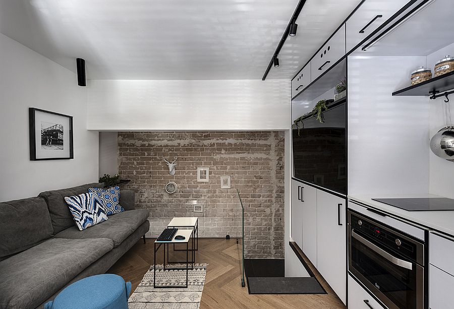 Interesting-brick-wall-section-of-the-apartment-adds-visual-contrast