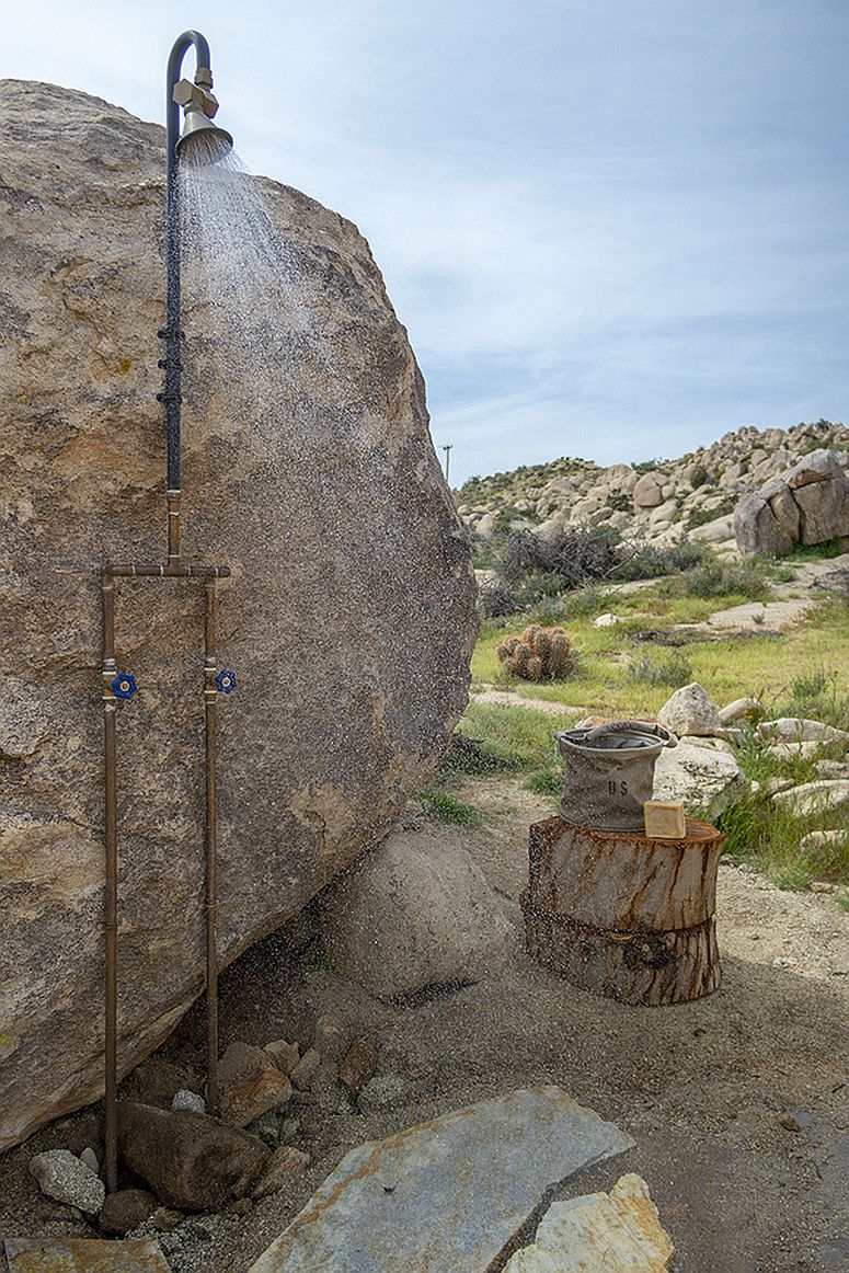 Landscape becomes an organic part of the house like this outdoor boulder shower area