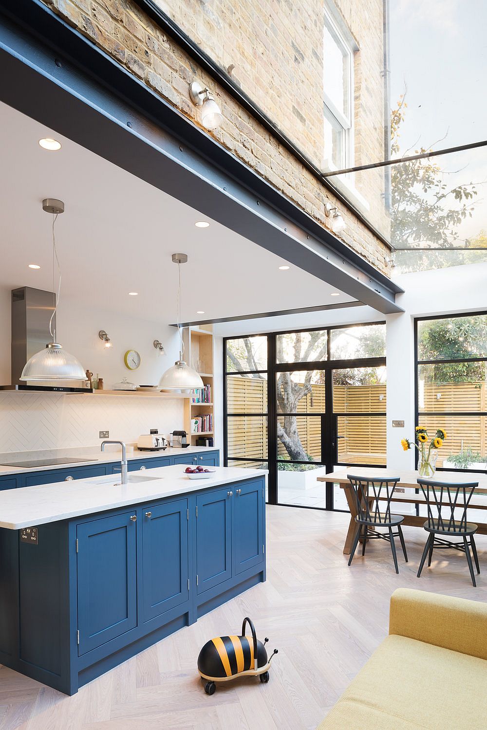 Large glass skylight fills the kitchen with natural light
