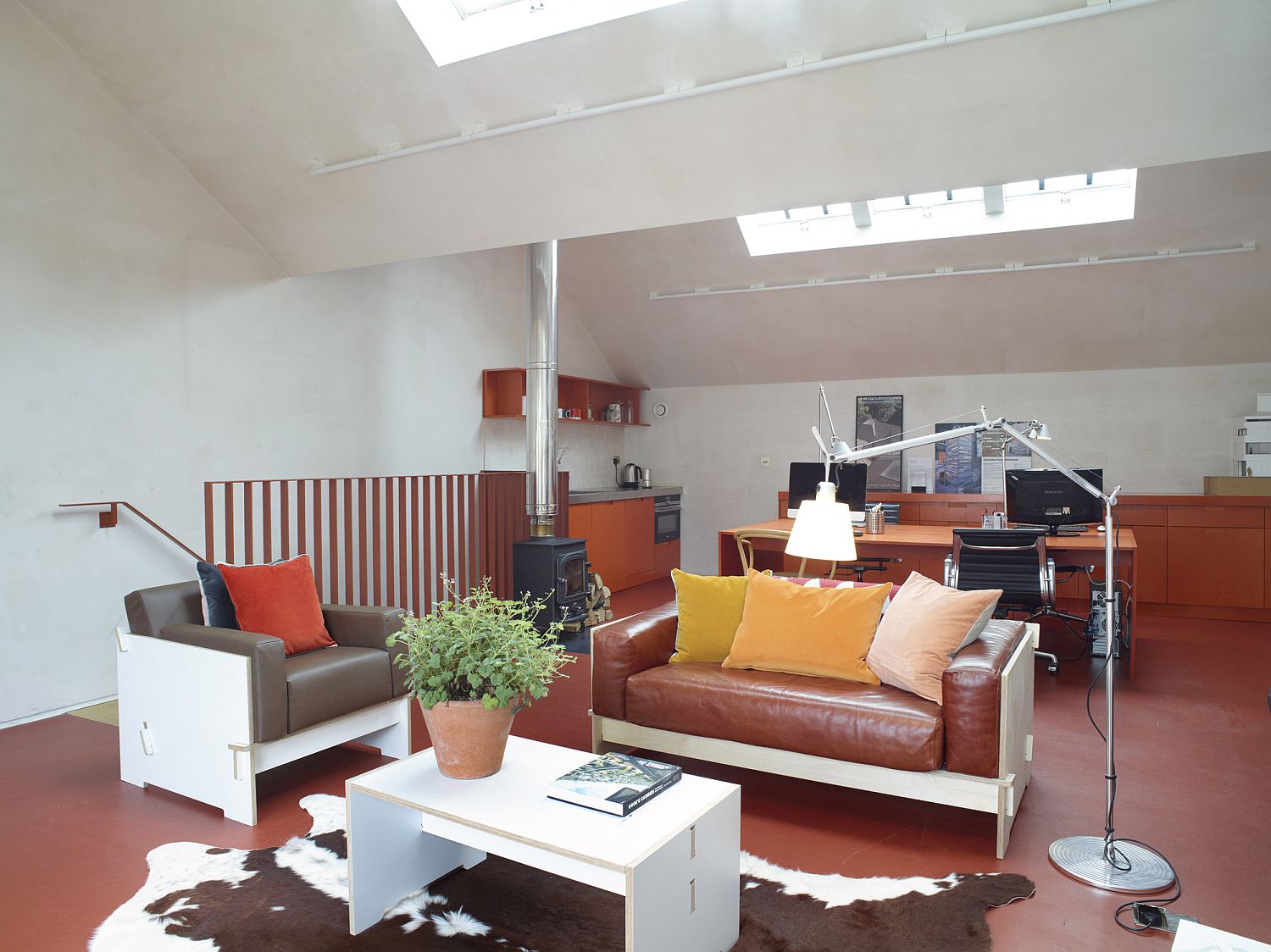 Light-filled living area in bright orange and white