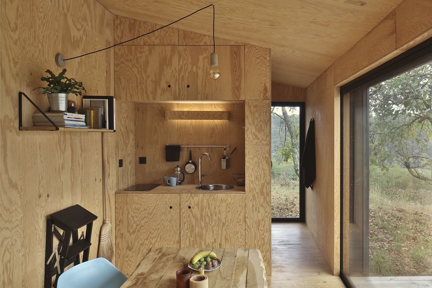 Lighter tones of wood shape the interior of the cabin