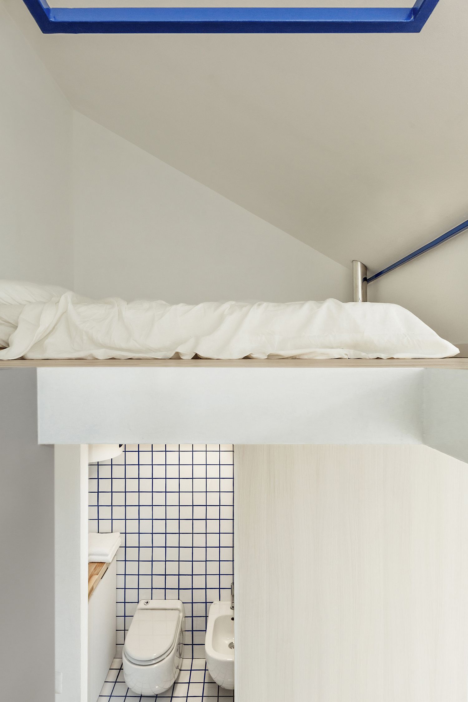 Loft level bed area inside the apartment saves ample space