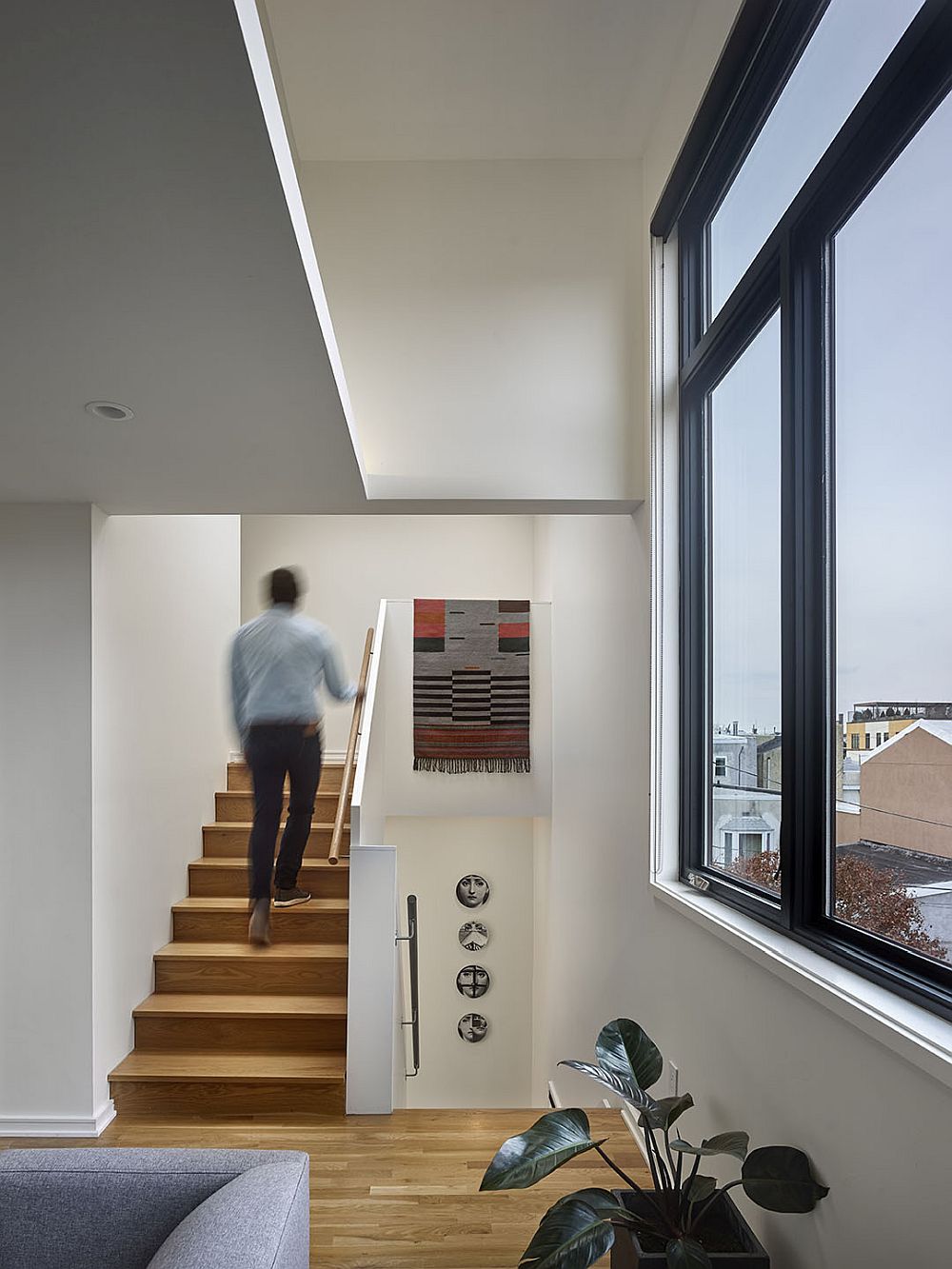 Modern staircase leading to the third level of the house