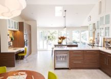 Spacious-kitchen-with-wooden-cabinets-and-an-ergonomic-home-office-217x155