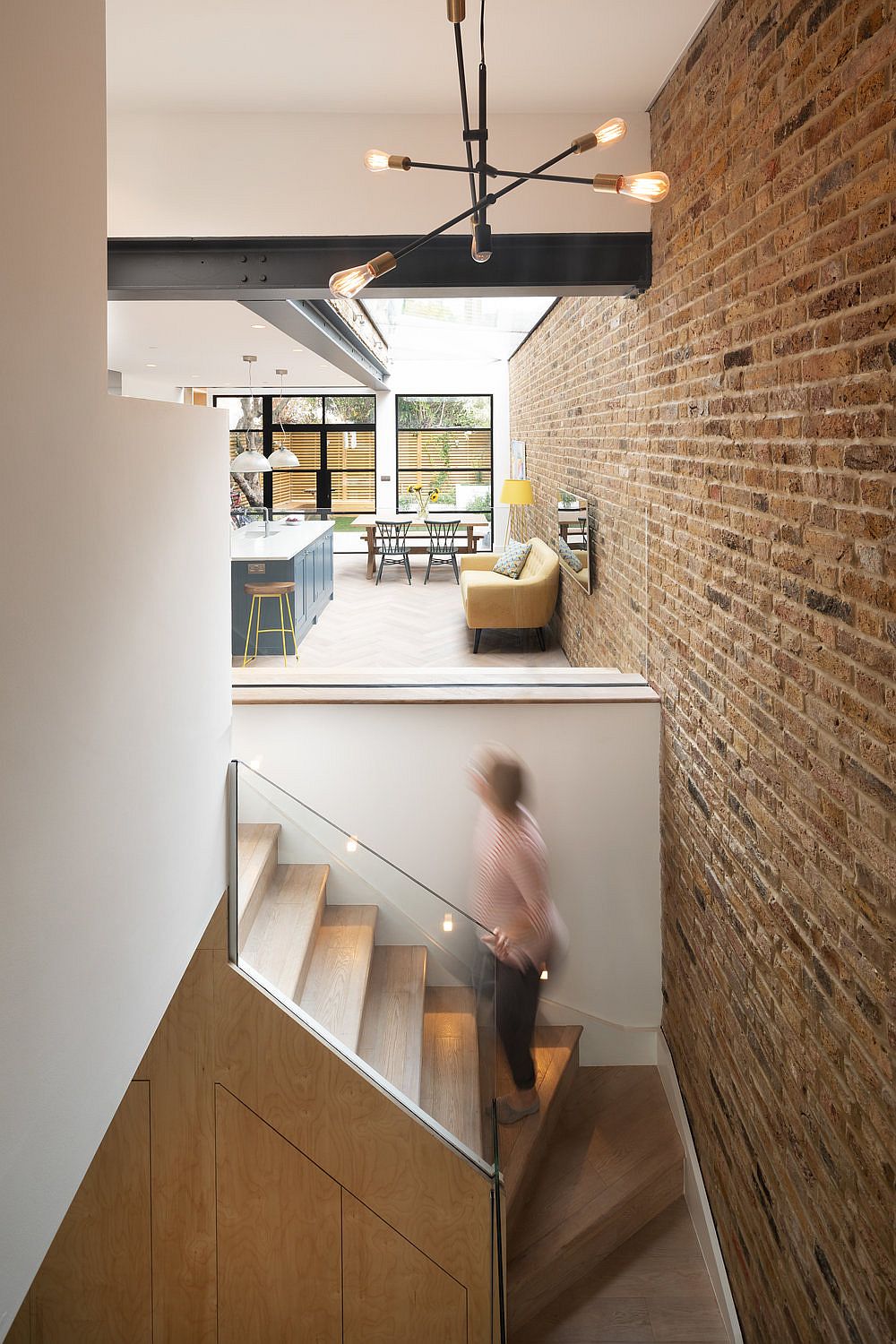 Staircase-leading-to-the-basement-level-of-the-revamped-British-house