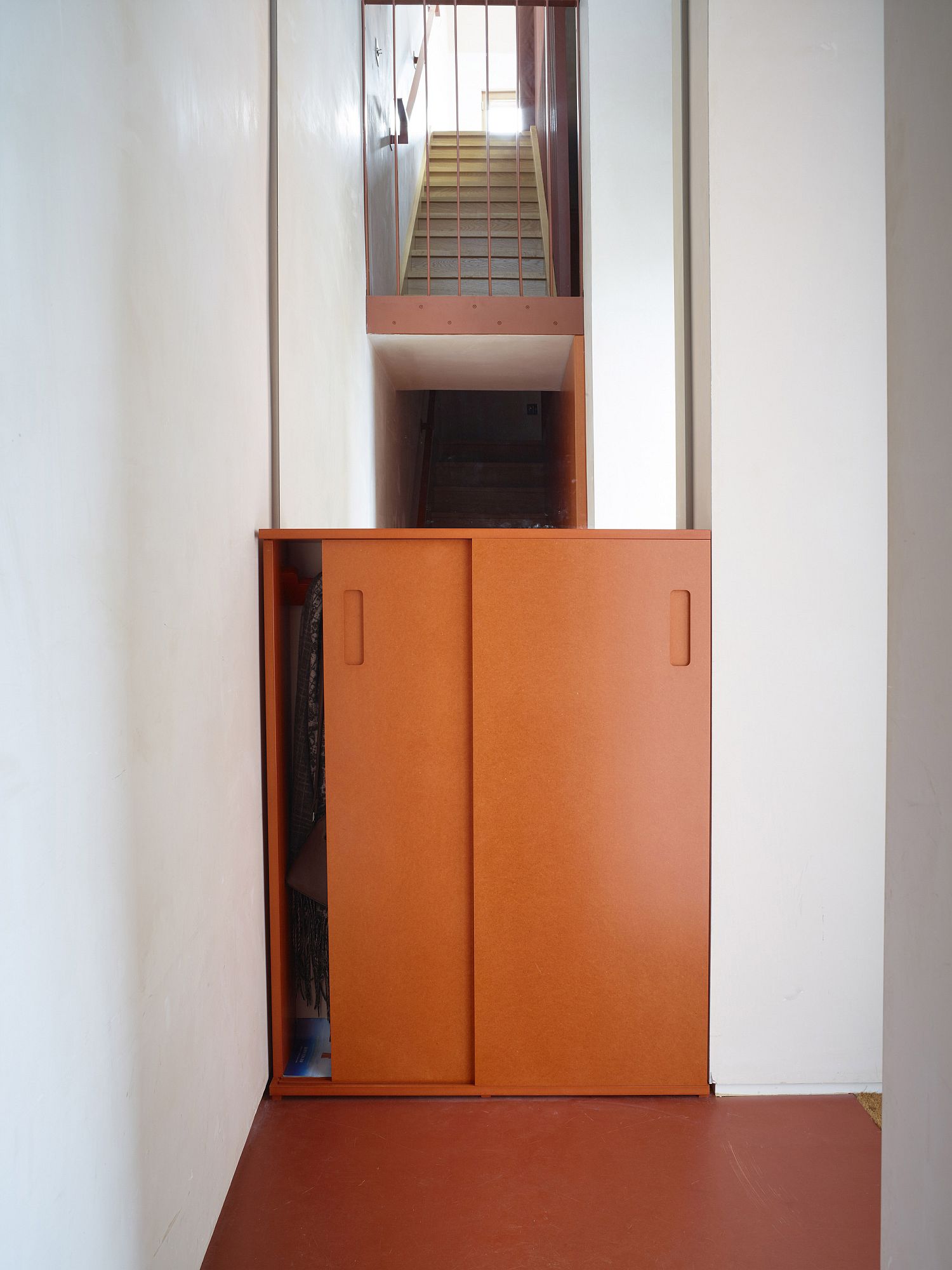 Stairway and the interior also embraces orange gleefully