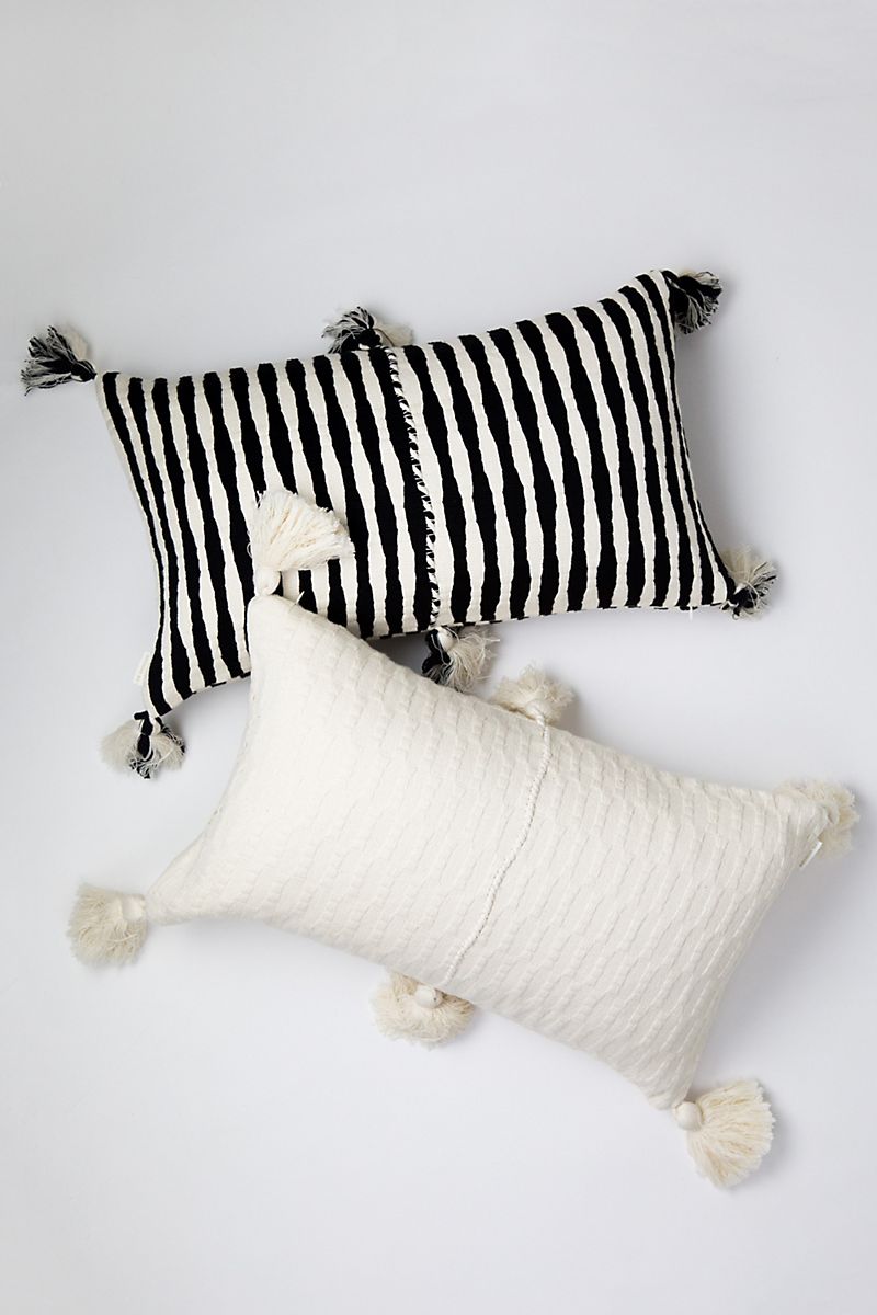 Tasseled pillows with stripes