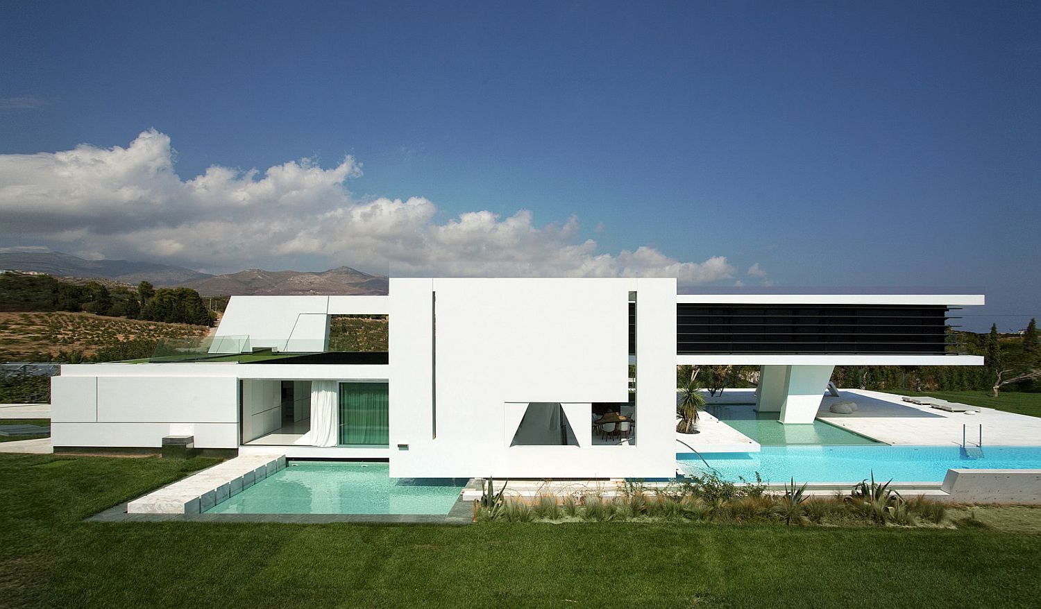 White and dark visual elements give the home a sleek, minimal vibe