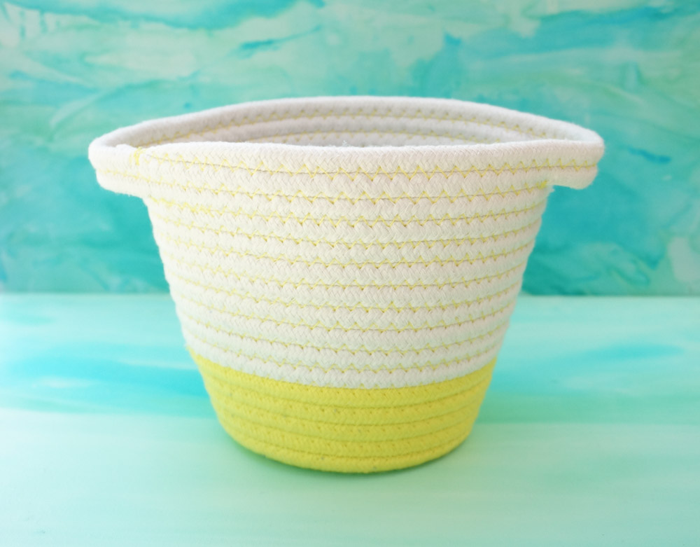 Yellow and white woven basket for storage