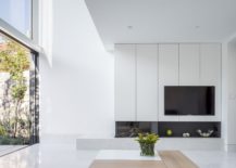 Appliances-bring-black-to-a-monochromatic-kitchen-in-white-217x155