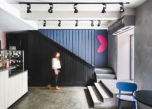 Black-anchors-the-cafe-takeaway-zone-with-color-and-concrete-217x155