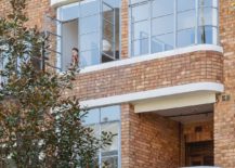Brick-exterior-of-the-building-that-holds-the-small-Sydney-apartment-217x155