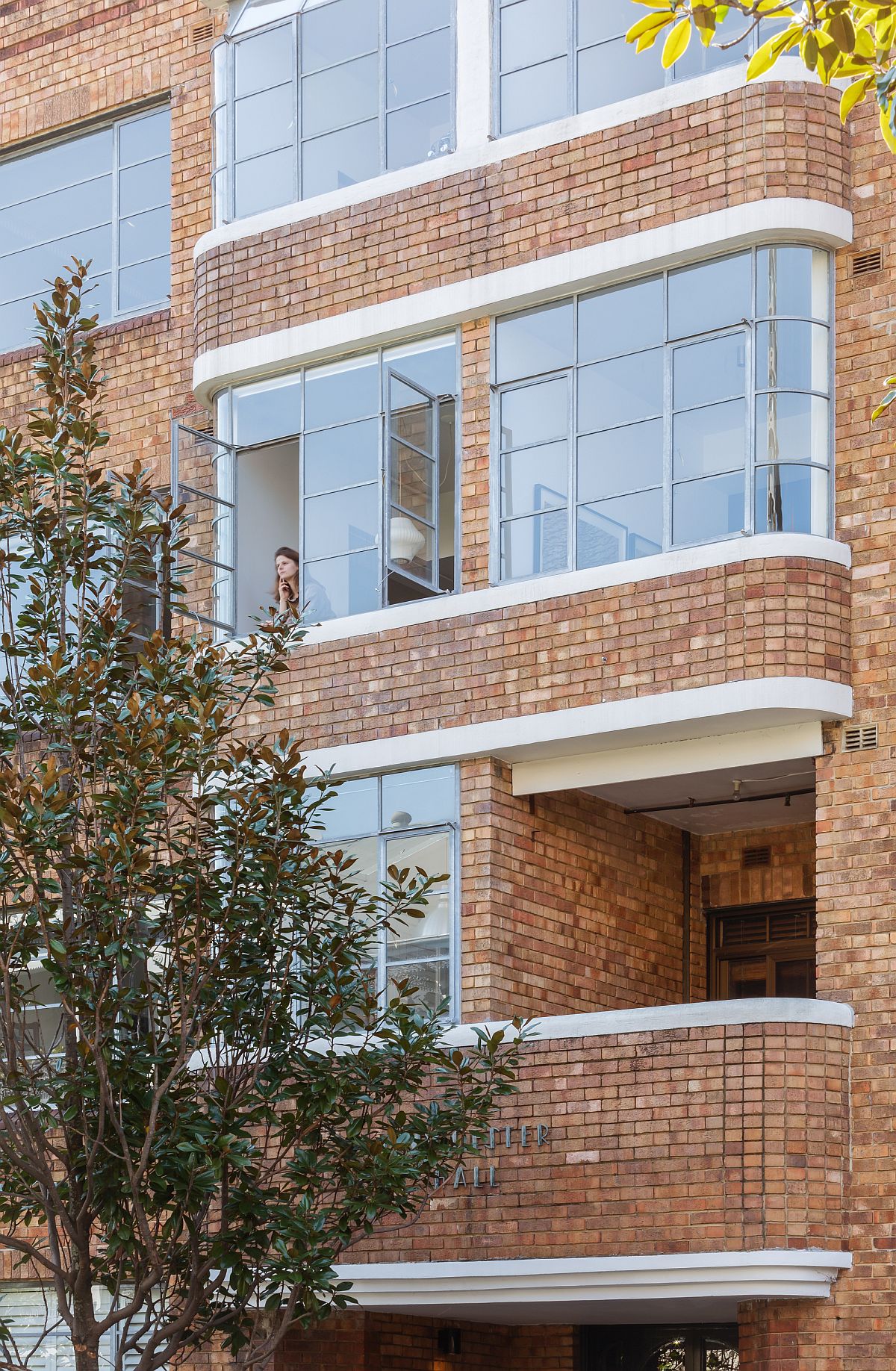 Brick exterior of the building that holds the small Sydney apartment