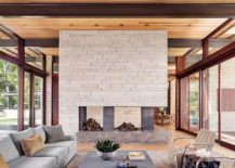 Central-fireplace-of-the-house-with-a-wall-that-adds-gray-217x155