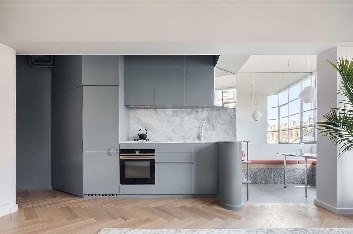 Contemporary kitchen in gray with wooden flooring for the tiny urban apartment