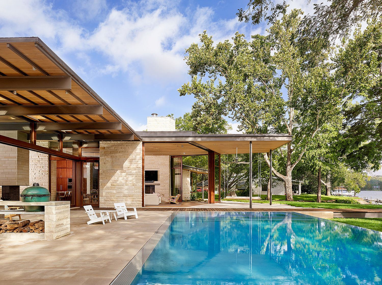 Deck and swimming pool area of the lavish lakeside Texas home