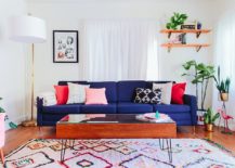 Deep-blue-sofa-in-the-living-room-steals-the-spotlight-with-ease-217x155