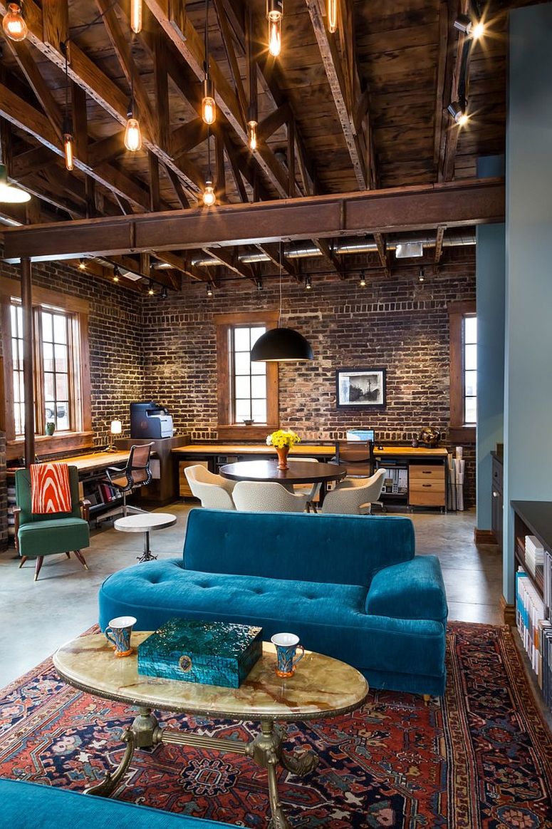 Double-height industrial living room with beautiful Edison bulb lighting